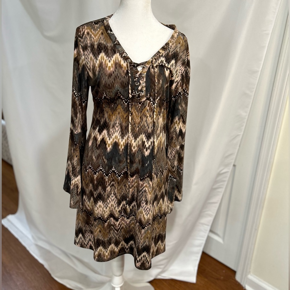 Brand new ARIELLA DRESS IN SIZE LARGE with a bell sleeve, tie at the chest WOT